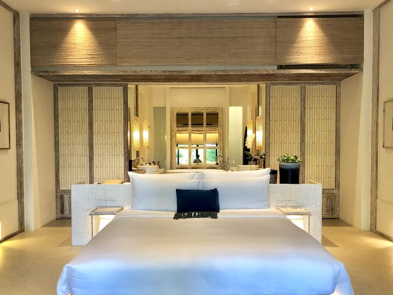 Luxury bedroom interior with rich furniture and scenic view from walkout deck