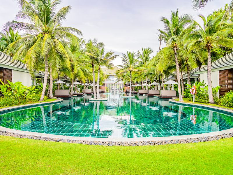 Outdoor Swimming pool in hotel resort for summer vacation background